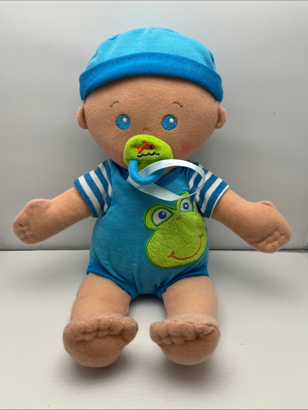 Plush Baby Doll with Blue Outfit and Frog Applique